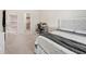 A comfortable bedroom with a grey blanket on the bed and a desk near a closet at 7455 Easton Valley Ln, Cumming, GA 30028