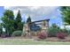 Landscaped Ansley Park community entrance sign with stone pillars and blooming flowers, creating an inviting welcome at 7455 Easton Valley Ln, Cumming, GA 30028