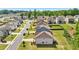 An aerial view showcases the back of similar homes with lush, green lawns in a well-maintained neighborhood at 7455 Easton Valley Ln, Cumming, GA 30028