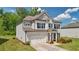 Beautiful two-story home with a brick facade, well-kept lawn, a two car garage and manicured landscaping at 7455 Easton Valley Ln, Cumming, GA 30028