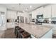 Spacious kitchen features white cabinetry, granite countertops, stainless steel appliances and a large pantry at 7455 Easton Valley Ln, Cumming, GA 30028