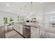 Well-equipped kitchen features a large island, granite countertops, and stainless steel appliances at 7455 Easton Valley Ln, Cumming, GA 30028