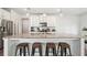 Kitchen island with granite countertops, pendant lighting, and seating for four at 7455 Easton Valley Ln, Cumming, GA 30028