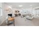 Open concept living area with fireplace, plush seating, and plenty of natural light at 7455 Easton Valley Ln, Cumming, GA 30028