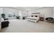 Spacious main bedroom with tray ceiling, work area, and sitting area at 7455 Easton Valley Ln, Cumming, GA 30028