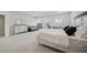 Generous main bedroom with a sitting area, large bed, and abundant natural light at 7455 Easton Valley Ln, Cumming, GA 30028