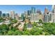 Stunning aerial view of the city skyline and lush green trees, offering a serene yet urban living experience at 1055 Piedmont Ne Ave # 409, Atlanta, GA 30309