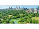 Picturesque aerial view capturing the city skyline and serene pond, creating an idyllic atmosphere at 1055 Piedmont Ne Ave # 409, Atlanta, GA 30309