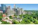 Captivating aerial perspective featuring the city skyline nestled amongst trees, providing an ideal urban-nature balance at 1055 Piedmont Ne Ave # 409, Atlanta, GA 30309