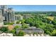 Expansive aerial view showcasing a mix of high-rise buildings and verdant green spaces offering a peaceful environment at 1055 Piedmont Ne Ave # 409, Atlanta, GA 30309