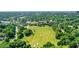 Breathtaking aerial of cityscape meeting a lush, green park with athletic fields, combining urban and recreational amenities at 1055 Piedmont Ne Ave # 409, Atlanta, GA 30309