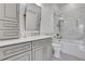 Well-lit bathroom featuring a sleek vanity, marble accents, and a glass-enclosed shower at 1055 Piedmont Ne Ave # 409, Atlanta, GA 30309