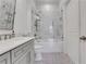 Elegant bathroom with marble tile, glass shower doors, and a modern vanity at 1055 Piedmont Ne Ave # 409, Atlanta, GA 30309