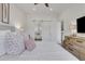 Cozy bedroom with modern decor, plush bedding, and a barn-style door for bathroom privacy at 1055 Piedmont Ne Ave # 409, Atlanta, GA 30309