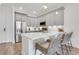 Bright kitchen with modern stainless steel appliances, sleek gray cabinets, quartz countertops and barstool seating at 1055 Piedmont Ne Ave # 409, Atlanta, GA 30309