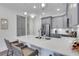 Contemporary kitchen features gray cabinets, quartz countertop island, and stainless appliances at 1055 Piedmont Ne Ave # 409, Atlanta, GA 30309