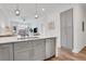 Stylish kitchen featuring an island with seating, stainless dishwasher, and view of living room at 1055 Piedmont Ne Ave # 409, Atlanta, GA 30309