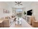 Bright living room with large sectional sofa, decorative accents, and outdoor view at 1055 Piedmont Ne Ave # 409, Atlanta, GA 30309