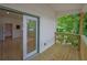 Relaxing wooden back deck with a view of green trees and open access to interior room at 1839 Belcher Pl, Austell, GA 30168