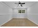 Finished basement featuring a drop ceiling, window for natural light, and recessed paneling at 1839 Belcher Pl, Austell, GA 30168