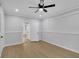 Finished basement with a drop ceiling, a window, recessed paneling, and a doorway to another room at 1839 Belcher Pl, Austell, GA 30168