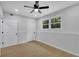Spacious bedroom with two entryways, ceiling fan and bright light from a window at 1839 Belcher Pl, Austell, GA 30168