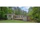 Beautiful house with a front porch, surrounded by mature trees and lush landscaping at 1839 Belcher Pl, Austell, GA 30168