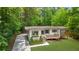 Charming exterior with a small deck and driveway at 1839 Belcher Pl, Austell, GA 30168