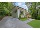 Exterior view of home with lush landscaping and a newly paved driveway at 1839 Belcher Pl, Austell, GA 30168