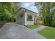 Exterior view of home with lush landscaping and a newly paved driveway at 1839 Belcher Pl, Austell, GA 30168