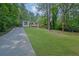 Charming home nestled in a lush green landscape with a well-manicured lawn at 1839 Belcher Pl, Austell, GA 30168