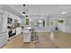 Bright kitchen features stainless steel appliances, center island, and ample natural light at 1839 Belcher Pl, Austell, GA 30168