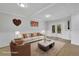 Bright living room with white trim, neutral walls, stylish furniture, and french doors to backyard at 1839 Belcher Pl, Austell, GA 30168
