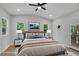 Cozy main bedroom with windows and back deck access featuring a comfortable bed setup at 1839 Belcher Pl, Austell, GA 30168