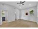 Large main bedroom with adjoining bathroom and walk-in closet entrances, and windows at 1839 Belcher Pl, Austell, GA 30168