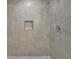 Modern shower featuring stone-look tile and convenient recessed niche at 1839 Belcher Pl, Austell, GA 30168