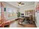 Cozy home office with hardwood floors, a large window, and a comfortable workspace at 317 Basel Way, Hampton, GA 30228