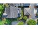 Aerial view of a home showcasing the roof, patio area with furniture, and landscaping at 6575 Eli Davis Rd, Cumming, GA 30040