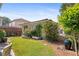 Secluded backyard with a lush lawn and a cozy outbuilding at 6575 Eli Davis Rd, Cumming, GA 30040
