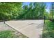 Outdoor basketball court with multiple hoops surrounded by trees at 6575 Eli Davis Rd, Cumming, GA 30040