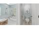 Modern bathroom with a separate tub and shower, plus a convenient toilet room at 6575 Eli Davis Rd, Cumming, GA 30040