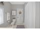 Bright bathroom features a toilet, walk-in shower, and a place to hang your towels and bathrobe at 6575 Eli Davis Rd, Cumming, GA 30040
