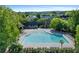 Aerial view of a resort-style community pool with lounge chairs at 6575 Eli Davis Rd, Cumming, GA 30040
