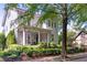Charming two-story home with a welcoming front porch, manicured landscaping, and a well-maintained lawn at 6575 Eli Davis Rd, Cumming, GA 30040