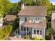 Charming two-story home with cedar shake roof, outdoor patio, and lovely balcony at 6575 Eli Davis Rd, Cumming, GA 30040