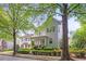 Charming two-story home with a welcoming front porch and mature trees at 6575 Eli Davis Rd, Cumming, GA 30040