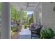 Cozy front porch with seating, a ceiling fan, and views of the neighborhood at 6575 Eli Davis Rd, Cumming, GA 30040