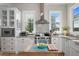 Well-equipped kitchen with stainless steel appliances and ample countertop space with natural light at 6575 Eli Davis Rd, Cumming, GA 30040