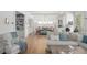 Open-concept living space with hardwood floors, dining area, and comfortable seating at 6575 Eli Davis Rd, Cumming, GA 30040