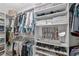 Spacious walk-in closet with organized shelving and hanging space for clothes and accessories at 6575 Eli Davis Rd, Cumming, GA 30040